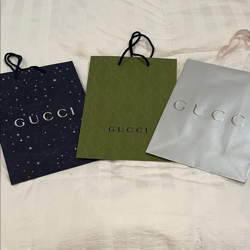 Gucci shopping bags Blue, Green, and Silver.